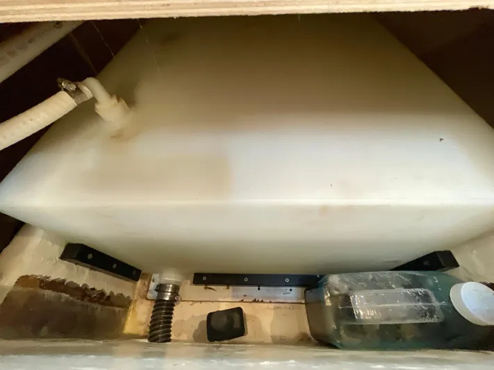 Gina Marie Yacht Photos Pics 1997 Tiara Yachts 3700 Open water tank compartment with hoses and storage.