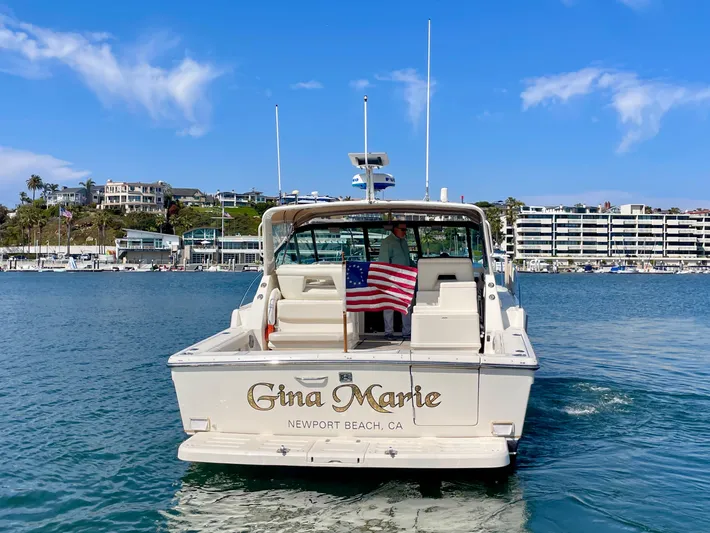 Gina Marie Yacht Photos Pics 1997 Tiara Yachts 3700 Open boat in Newport Beach, CA, with American flag.