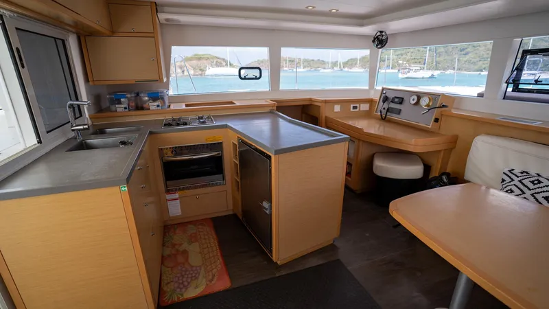 Altair Yacht Photos Pics Interior of 2018 Lagoon 450 F catamaran with modern kitchen and navigation area.