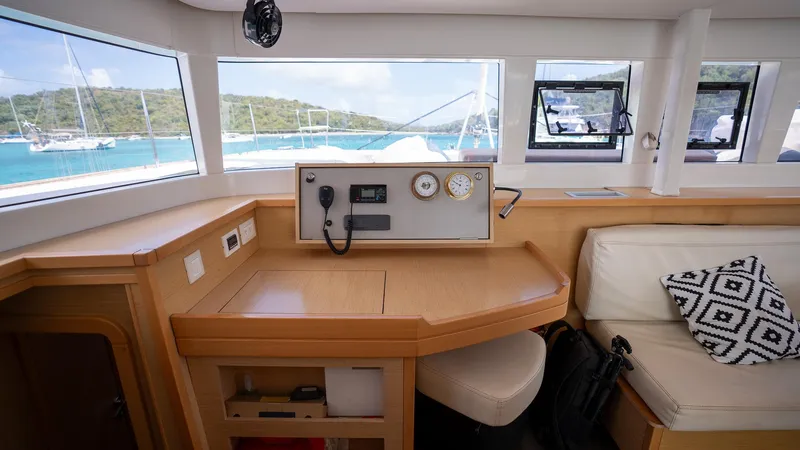 Altair Yacht Photos Pics Interior of 2018 Lagoon 450 F yacht with navigation panel and seating area.