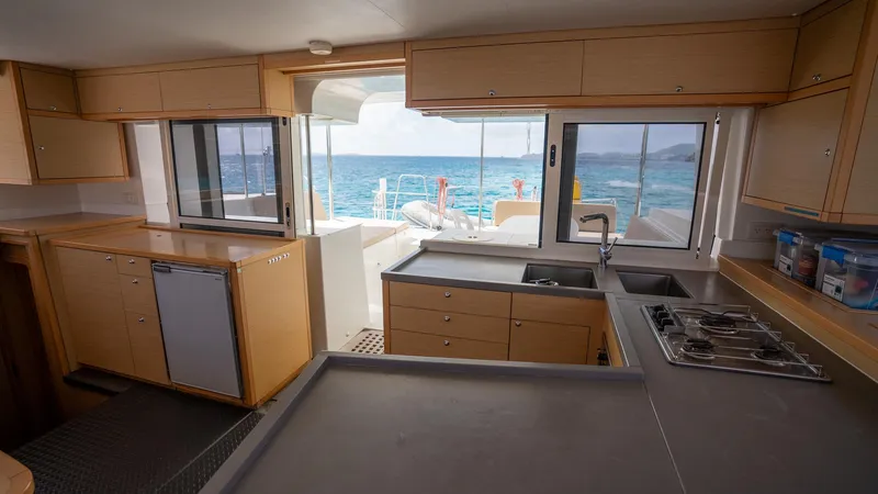 Altair Yacht Photos Pics Interior of 2018 Lagoon 450 F catamaran with modern kitchen and ocean view.