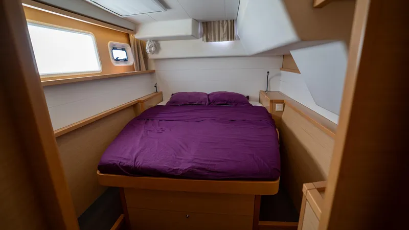 Altair Yacht Photos Pics Interior cabin of 2018 Lagoon 450 F catamaran with purple bedding.