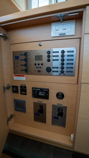 Altair Yacht Photos Pics Control panel inside 2018 Lagoon 450 F yacht, featuring various switches and displays.