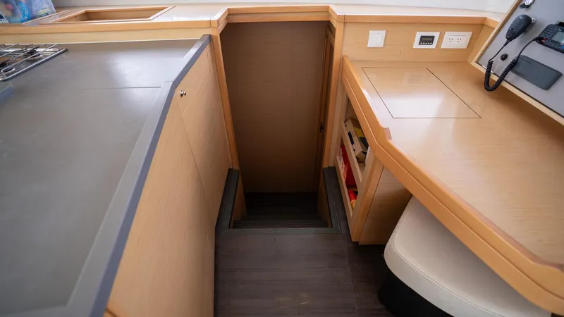 Altair Yacht Photos Pics Interior of 2018 Lagoon 450 F yacht, featuring wooden cabinetry and stairs.