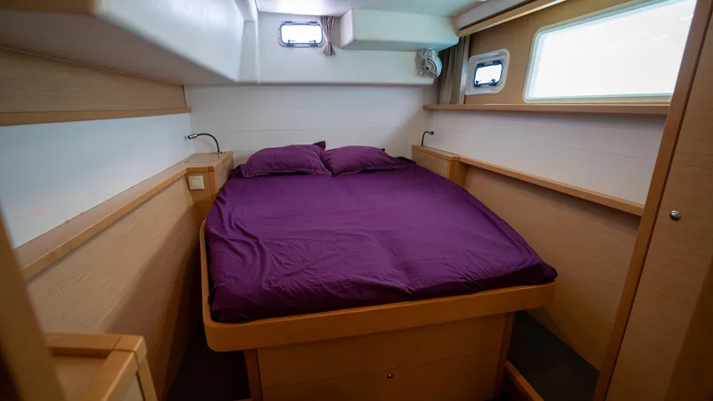 Altair Yacht Photos Pics Cozy bedroom in 2018 Lagoon 450 F yacht with purple bedding.