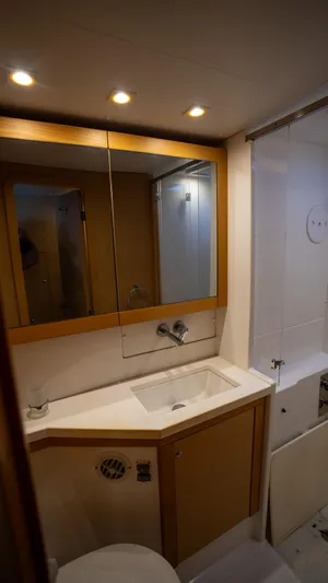 Altair Yacht Photos Pics Bathroom interior of 2018 Lagoon 450 F yacht, featuring modern fixtures and lighting.