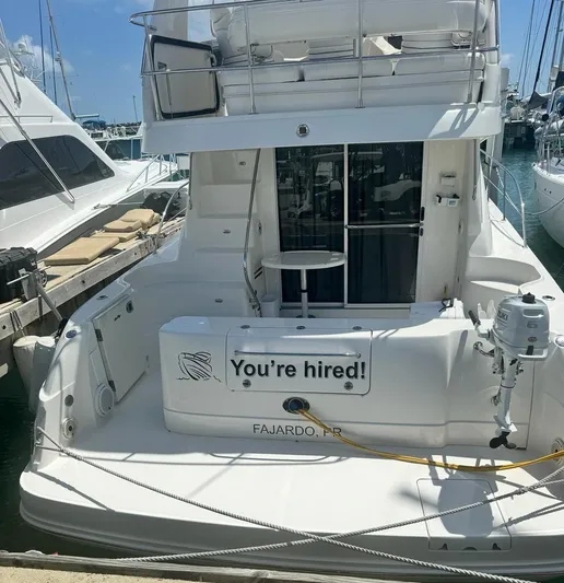  Yacht Photos Pics 2007 Sea Ray 44 Sedan Bridge docked in Fajardo, PR with You're hired! sign.