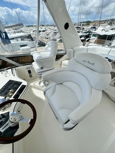  Yacht Photos Pics 2007 Sea Ray 44 Sedan Bridge helm with luxurious white captain's chairs.