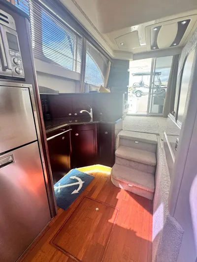  Yacht Photos Pics Interior of 2007 Sea Ray 44 Sedan Bridge yacht with kitchen and stairs.