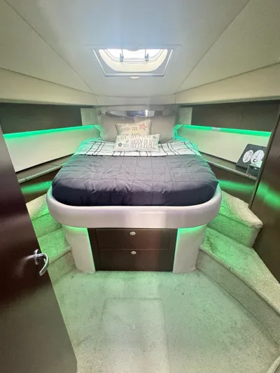  Yacht Photos Pics 2007 Sea Ray 44 Sedan Bridge yacht bedroom with modern lighting and cozy bed.