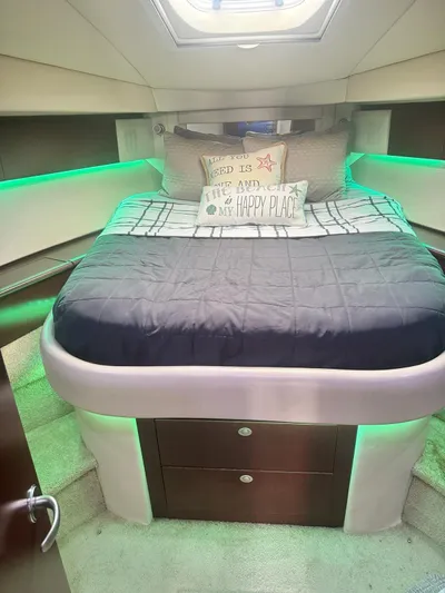  Yacht Photos Pics Luxurious bedroom in a 2007 Sea Ray 44 Sedan Bridge yacht with green LED lighting.