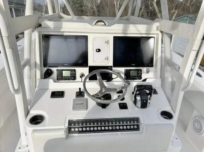  Yacht Photos Pics 2018 Invincible 36 Open boat helm with dual screens and navigation controls.