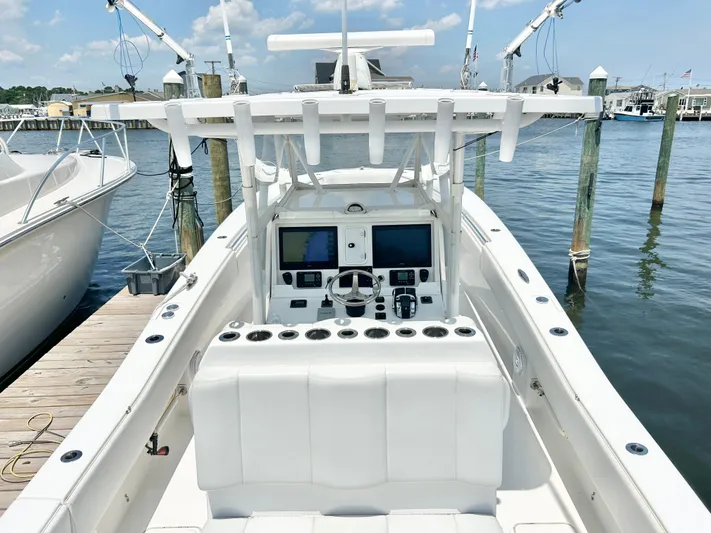  Yacht Photos Pics 2018 Invincible 36 Open boat docked at marina, view of helm and seating.