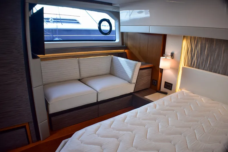  Yacht Photos Pics Luxurious interior of 2019 Tiara Yachts C49 Coupe with cozy seating and elegant lighting.