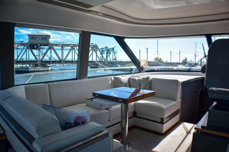  Yacht Photos Pics Luxurious interior of 2019 Tiara Yachts C49 Coupe with scenic marina view.