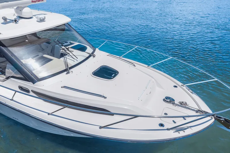  Yacht Photos Pics 2021 Boston Whaler 325 Conquest boat on clear blue water.