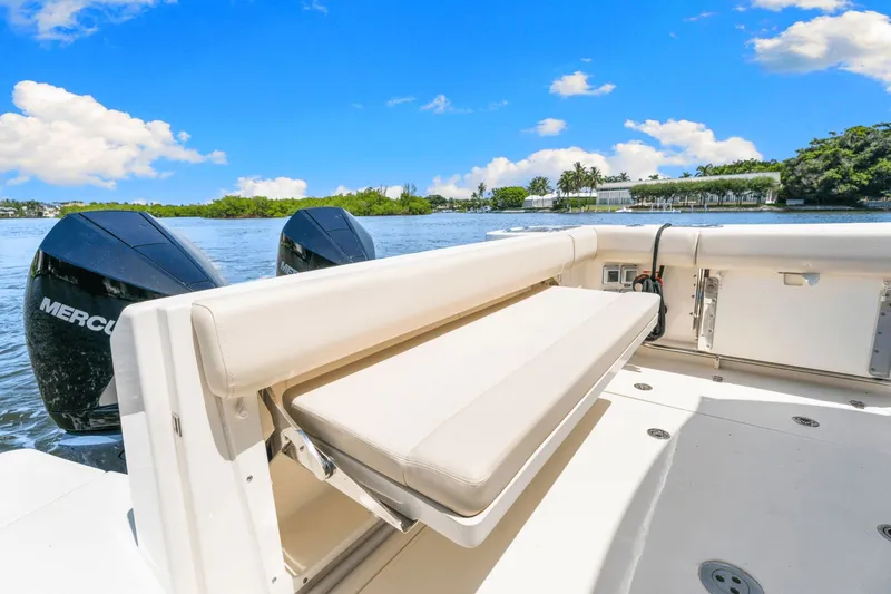  Yacht Photos Pics 2021 Boston Whaler 325 Conquest boat with dual Mercury engines on a sunny day.