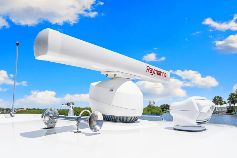  Yacht Photos Pics Boston Whaler 325 Conquest 2021 radar and equipment under clear blue sky.