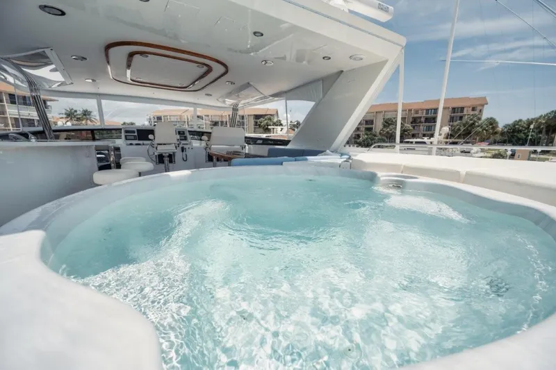 Island Girl Yacht Photos Pics Luxurious 2002 Westport 112 yacht with a spacious deck jacuzzi and modern amenities.