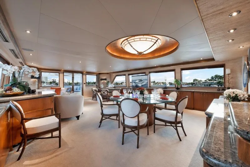 Island Girl Yacht Photos Pics Luxurious interior of 2002 Westport 112 yacht with elegant dining area and panoramic windows.