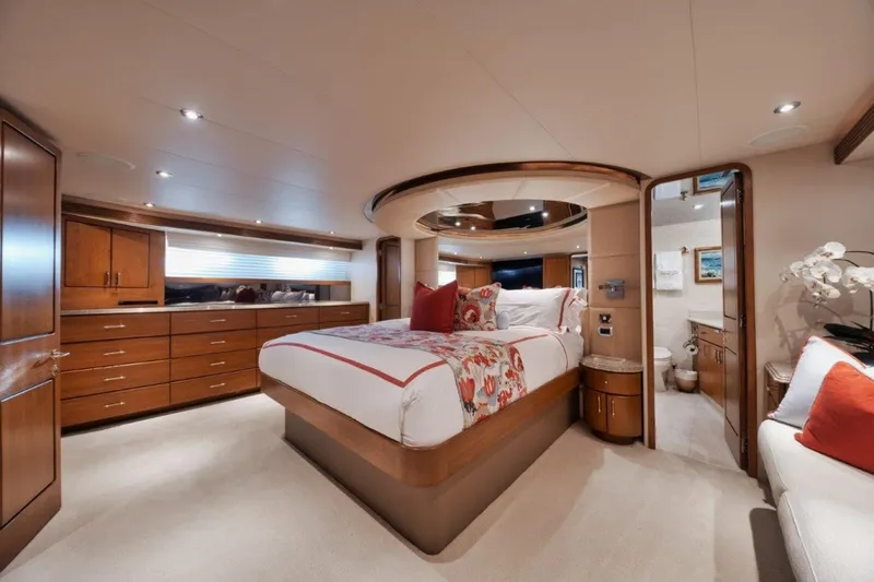 Island Girl Yacht Photos Pics Luxurious bedroom interior of 2002 Westport 112 yacht with elegant wood furnishings.