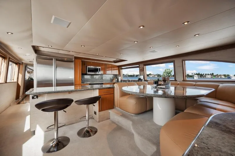 Island Girl Yacht Photos Pics Luxurious interior of 2002 Westport 112 yacht with modern kitchen and dining area.
