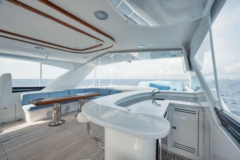 Island Girl Yacht Photos Pics Luxurious 2002 Westport 112 yacht interior with elegant seating and ocean view.