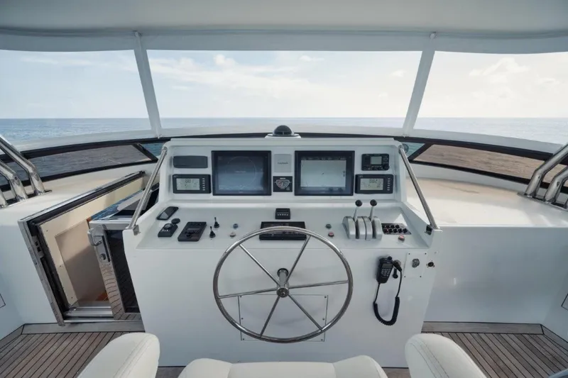 Island Girl Yacht Photos Pics Helm of 2002 Westport 112 yacht with navigation equipment and ocean view.