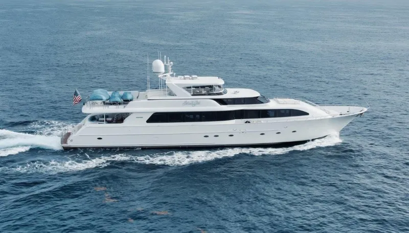 Island Girl Yacht Photos Pics Luxurious 2002 Westport 112 yacht cruising on open sea, side view.