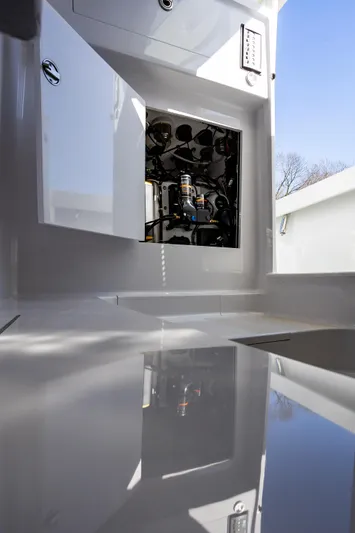 Hot Rod Yacht Photos Pics Engine compartment of 2005 French Yachts 34 Center Console, showcasing interior details.