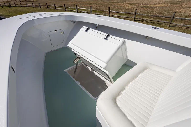 Hot Rod Yacht Photos Pics 2005 French Yachts 34 Center Console interior with white seating and storage compartment.