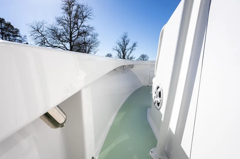 Hot Rod Yacht Photos Pics 2005 French Yachts 34 Center Console, sleek white deck, clear sky background.