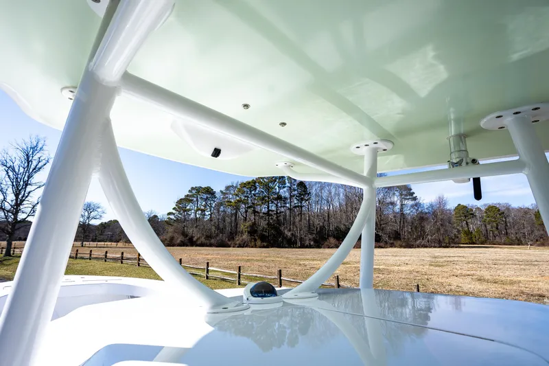 Hot Rod Yacht Photos Pics 2005 French Yachts 34 Center Console, view of structure and countryside background.