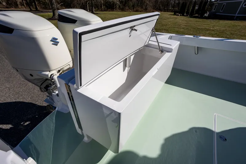 Hot Rod Yacht Photos Pics 2005 French Yachts 34 Center Console with open storage compartment and dual Suzuki outboard engines.