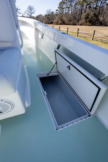 Hot Rod Yacht Photos Pics 2005 French Yachts 34 Center Console with open storage compartment on deck.