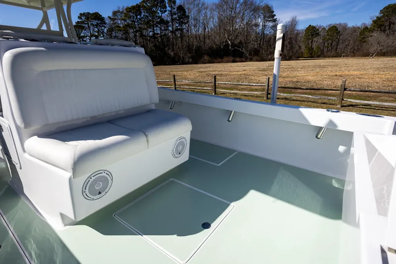 Hot Rod Yacht Photos Pics 2005 French Yachts 34 Center Console interior with white seating and outdoor view.