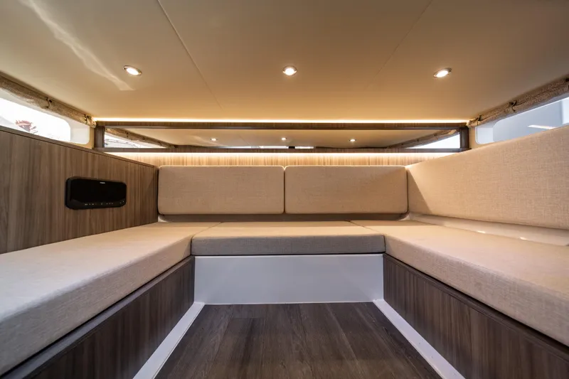 Nauti Tiger Yacht Photos Pics Luxurious interior of 2024 Sea Ray Sundancer 370 yacht with elegant seating and ambient lighting.
