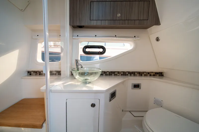 Nauti Tiger Yacht Photos Pics Luxurious bathroom interior of 2024 Sea Ray Sundancer 370 yacht with modern fixtures.