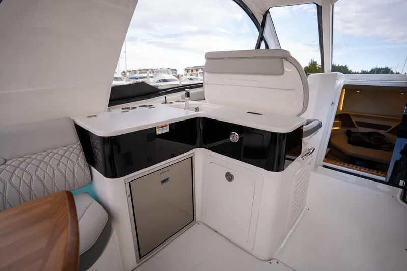 Nauti Tiger Yacht Photos Pics 2024 Sea Ray Sundancer 370 interior with sleek kitchenette and modern design.