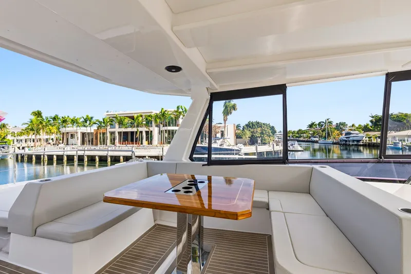 Better Now Yacht Photos Pics 2023 Leopard 46 Powercat interior with elegant seating and waterfront view.