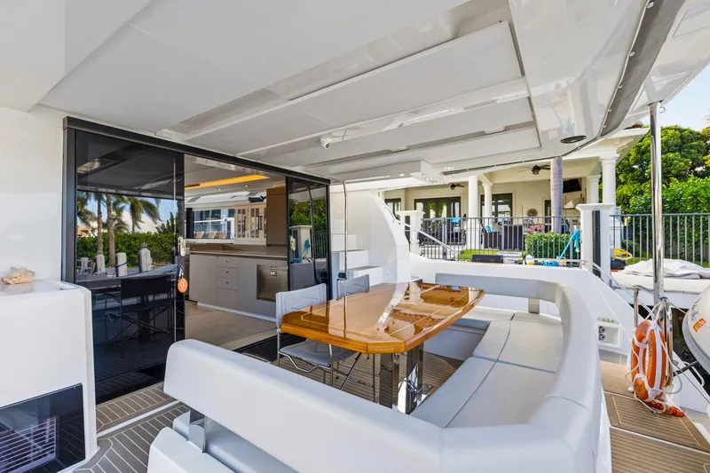 Better Now Yacht Photos Pics Luxurious 2023 Leopard 46 Powercat yacht with elegant outdoor dining area and modern interior.