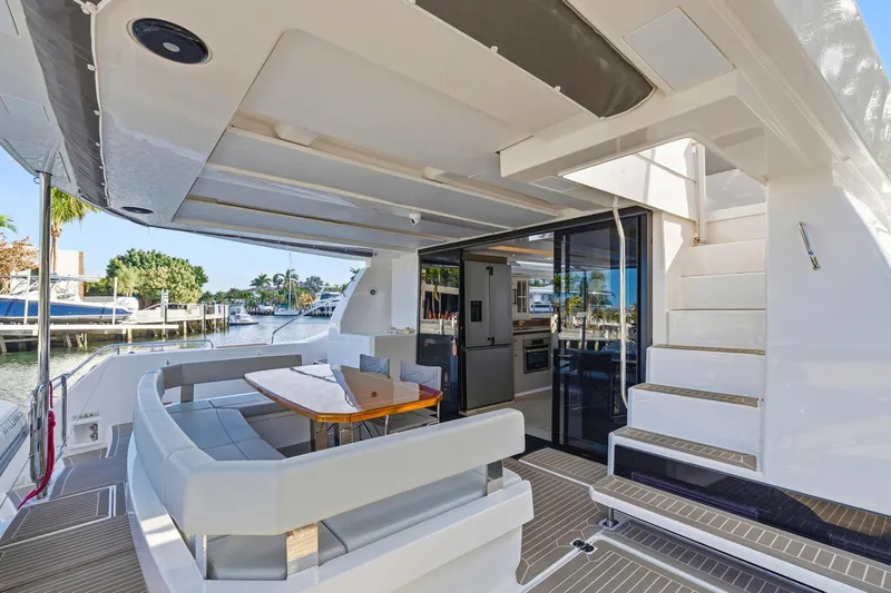 Better Now Yacht Photos Pics 2023 Leopard 46 Powercat yacht with spacious outdoor seating and modern interior design.