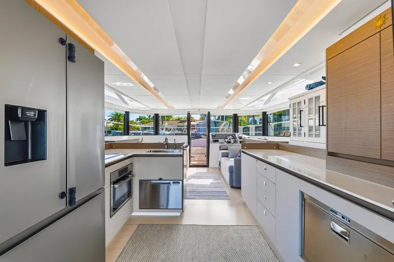 Better Now Yacht Photos Pics Luxurious interior of 2023 Leopard 46 Powercat yacht with modern kitchen and spacious layout.