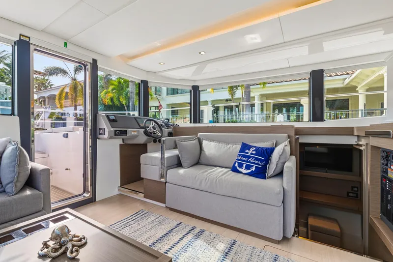 Better Now Yacht Photos Pics Luxurious interior of 2023 Leopard 46 Powercat yacht with modern seating and helm station.