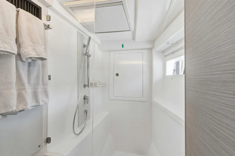 Better Now Yacht Photos Pics Modern bathroom in 2023 Leopard 46 Powercat yacht with shower and towels.