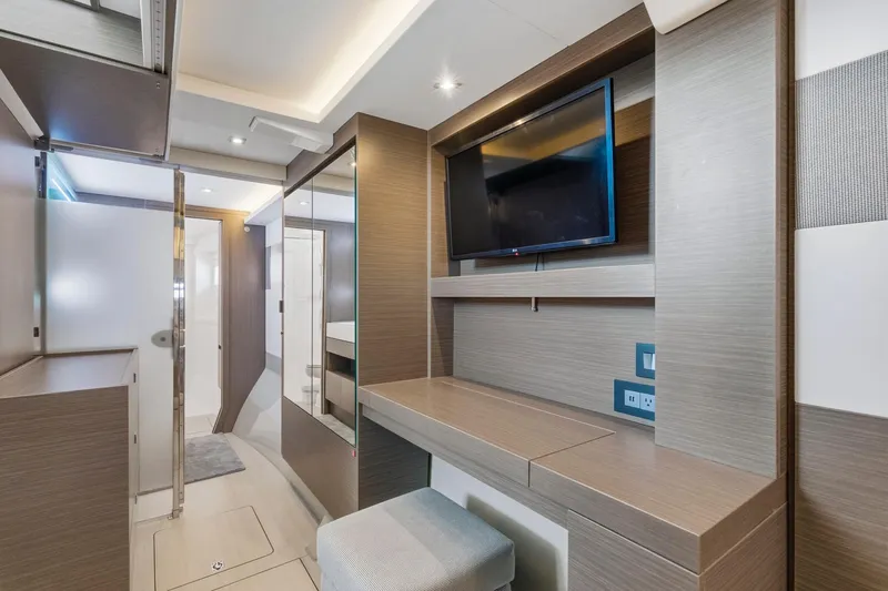 Better Now Yacht Photos Pics Modern interior of 2023 Leopard 46 Powercat yacht with TV and sleek design.