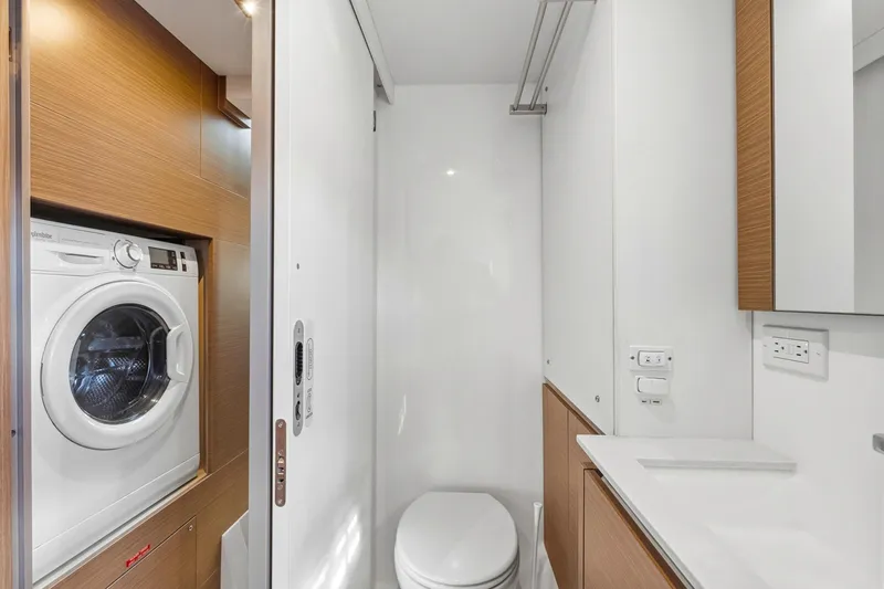 Better Now Yacht Photos Pics Laundry and bathroom area in 2023 Leopard 46 Powercat yacht, featuring modern amenities.