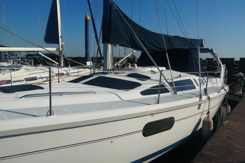Andiamo Yacht Photos Pics 1998 Hunter 410 sailboat docked at marina under clear blue sky.