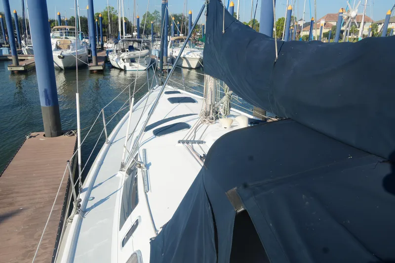 Andiamo Yacht Photos Pics Sailboat docked at marina, Hunter 410 model, 1998, with covered sails.