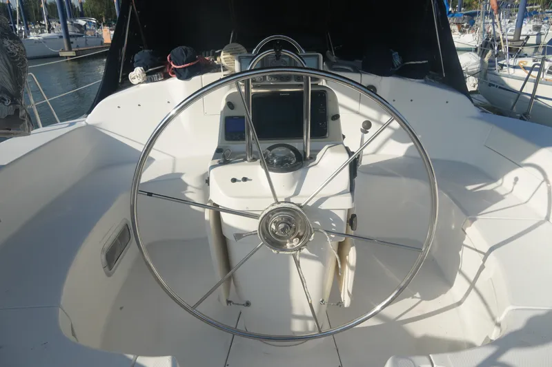 Andiamo Yacht Photos Pics Cockpit of 1998 Hunter 410 sailboat with steering wheel and navigation equipment.